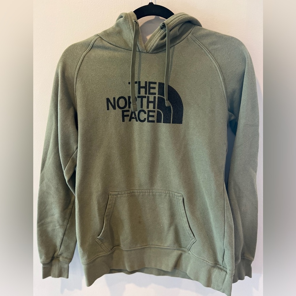 Green hoodie, soft material.